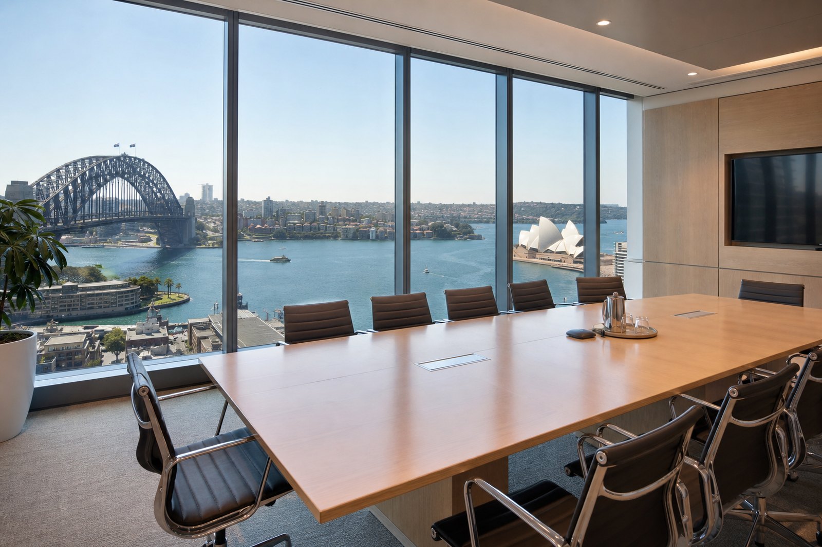 Sydney Harbour boardroom, Harbour Bridge and Opera House beyond the glass